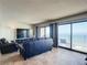 Comfortable living room with stunning ocean views through sliding glass doors at 4445 S Atlantic Ave # 804, Ponce Inlet, FL 32127
