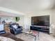 Bright living room featuring comfortable seating and an entertainment center at 4445 S Atlantic Ave # 804, Ponce Inlet, FL 32127