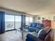 Cozy living room offering stunning ocean views from large windows at 4445 S Atlantic Ave # 804, Ponce Inlet, FL 32127