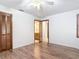 Bedroom featuring a ceiling fan, neutral walls, vinyl flooring and wood closets at 448 Shorewood Ln, New Smyrna Beach, FL 32168