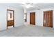 Bedroom featuring a ceiling fan, neutral walls, carpet flooring, and closet with wood doors at 448 Shorewood Ln, New Smyrna Beach, FL 32168