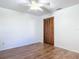 Bedroom featuring a ceiling fan, neutral walls, vinyl flooring and wood closets at 448 Shorewood Ln, New Smyrna Beach, FL 32168