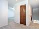 Second floor hallway featuring a storage closet, carpet, and a partial view of the room below at 448 Shorewood Ln, New Smyrna Beach, FL 32168