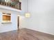 Spacious living room featuring wood-look floors, a view to a balcony, and an open design at 448 Shorewood Ln, New Smyrna Beach, FL 32168