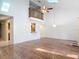 Large living room with wood-look flooring, balcony and an open design at 448 Shorewood Ln, New Smyrna Beach, FL 32168