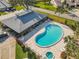 Aerial view of community pool and spa area, complete with ample lounge chairs at 448 Shorewood Ln, New Smyrna Beach, FL 32168