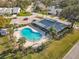 Aerial view of a community pool and spa, featuring ample seating and palm trees at 448 Shorewood Ln, New Smyrna Beach, FL 32168