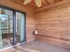 Cozy screened-in porch with wood paneling, slider windows, and lake views at 448 Shorewood Ln, New Smyrna Beach, FL 32168