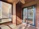 Screened porch features stylish wood details and a sliding glass door, inviting in serene views at 448 Shorewood Ln, New Smyrna Beach, FL 32168