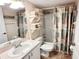 Relaxing bathroom with shower, vanity, and shelves, perfect for personal care and convenience at 4860 S Atlantic Ave # 1030, New Smyrna Beach, FL 32169