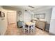 Cozy dining area with a table and chairs, perfect for enjoying meals with Gathering and friends at 4860 S Atlantic Ave # 1030, New Smyrna Beach, FL 32169