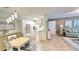 Open-concept living space combining a dining area and living room, creating an inviting and connected atmosphere at 4860 S Atlantic Ave # 1030, New Smyrna Beach, FL 32169