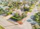 A corner-lot home with manicured landscaping featuring mature trees, with easy access to neighborhood streets at 601 N Peninsula Ave, New Smyrna Beach, FL 32169