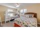 Bedroom featuring bunkbeds, a bed, side table and windows with coverings at 601 N Peninsula Ave, New Smyrna Beach, FL 32169
