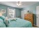 Bedroom featuring a bed, dresser, closet and window with coverings at 601 N Peninsula Ave, New Smyrna Beach, FL 32169
