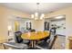 Bright dining area featuring modern lighting and access to the kitchen and living spaces at 601 N Peninsula Ave, New Smyrna Beach, FL 32169