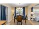 Cozy dining area with contemporary lighting and comfortable seating near the living room at 601 N Peninsula Ave, New Smyrna Beach, FL 32169