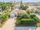Charming single-story home featuring a well-manicured lawn, mature landscaping, and a concrete driveway at 601 N Peninsula Ave, New Smyrna Beach, FL 32169