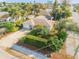 Charming single-story home featuring a well-manicured lawn, mature landscaping, and a concrete driveway at 601 N Peninsula Ave, New Smyrna Beach, FL 32169