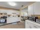 Cozy kitchen area with white cabinets and stainless steel gas range at 601 N Peninsula Ave, New Smyrna Beach, FL 32169
