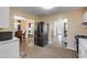 Spacious kitchen with black stainless steel appliances, open to the living room and dining area at 601 N Peninsula Ave, New Smyrna Beach, FL 32169