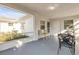 Covered lanai featuring ample seating, views of the exterior, and a bright atmosphere at 601 N Peninsula Ave, New Smyrna Beach, FL 32169