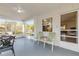Enclosed lanai with seating area offering natural light and a serene outdoor view at 601 N Peninsula Ave, New Smyrna Beach, FL 32169