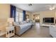 Cozy living room featuring natural light, tile flooring, and an open layout at 601 N Peninsula Ave, New Smyrna Beach, FL 32169