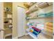 Linen closet featuring ample storage with shelves and organized towels and necessities at 601 N Peninsula Ave, New Smyrna Beach, FL 32169