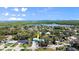 Stunning aerial view showcasing the property nestled within a lush, green landscape and waterfront community at 61 E Bayshore Dr, Port Orange, FL 32127