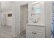 Neutral bathroom includes a spacious vanity with plenty of storage and great lighting at 61 E Bayshore Dr, Port Orange, FL 32127