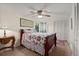 Cozy bedroom featuring a ceiling fan, comfortable bed with patterned bedding, and ample closet space at 61 E Bayshore Dr, Port Orange, FL 32127