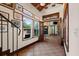 Welcoming entryway featuring tile floors, multiple windows, wood trim, and a glimpse of the living room at 61 E Bayshore Dr, Port Orange, FL 32127