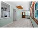 Bright entryway with tile flooring, natural light, and open doorway at 61 E Bayshore Dr, Port Orange, FL 32127