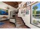 Elegant foyer with a staircase, wood ceiling, chandelier, and views of the pool through a bright window at 61 E Bayshore Dr, Port Orange, FL 32127