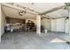Spacious garage with concrete flooring, and storage space at 61 E Bayshore Dr, Port Orange, FL 32127