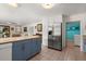 Eat-in kitchen featuring stainless steel appliances, and access to the laundry area at 61 E Bayshore Dr, Port Orange, FL 32127