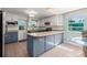 Eat-in kitchen featuring white cabinetry, stone countertops and neutral tile floor at 61 E Bayshore Dr, Port Orange, FL 32127