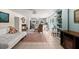 Open-concept living room with a view into the dining and kitchen areas, tile floors, and natural light at 61 E Bayshore Dr, Port Orange, FL 32127