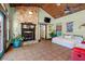 Spacious main bedroom with a stone fireplace and tiled floors at 61 E Bayshore Dr, Port Orange, FL 32127