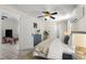 Comfortable bedroom featuring tiled floors, a ceiling fan, and a blue dresser at 61 E Bayshore Dr, Port Orange, FL 32127