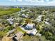 Scenic aerial view of a two-story home with a charming front porch and mature trees at 622 Faulkner St, New Smyrna Beach, FL 32168