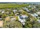 Beautiful, expansive aerial view of a home surrounded by lush greenery and mature trees at 622 Faulkner St, New Smyrna Beach, FL 32168