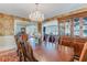 Formal dining room featuring a large table, elegant chairs, and a crystal chandelier at 622 Faulkner St, New Smyrna Beach, FL 32168