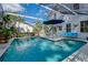 This inviting screened pool is surrounded by a large patio, perfect for entertaining and relaxing at 622 Faulkner St, New Smyrna Beach, FL 32168