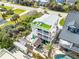 Beautiful aerial view of the property featuring a multi-story home, backyard gazebo, and surrounding landscape at 6531 Turtlemound Rd, New Smyrna Beach, FL 32169