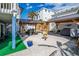 Spacious backyard with gravel groundcover, dual pergolas and fountain, perfect for outdoor entertaining at 6531 Turtlemound Rd, New Smyrna Beach, FL 32169
