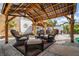 Backyard patio showcases a gazebo with seating area, providing a relaxing outdoor space for entertaining at 6531 Turtlemound Rd, New Smyrna Beach, FL 32169
