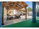 Outdoor patio featuring a gazebo, stylish seating, and decorative elements in a cozy, well-manicured backyard at 6531 Turtlemound Rd, New Smyrna Beach, FL 32169
