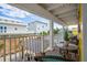 Scenic balcony view with cozy seating, offering a relaxing spot to enjoy the neighborhood scenery at 6531 Turtlemound Rd, New Smyrna Beach, FL 32169